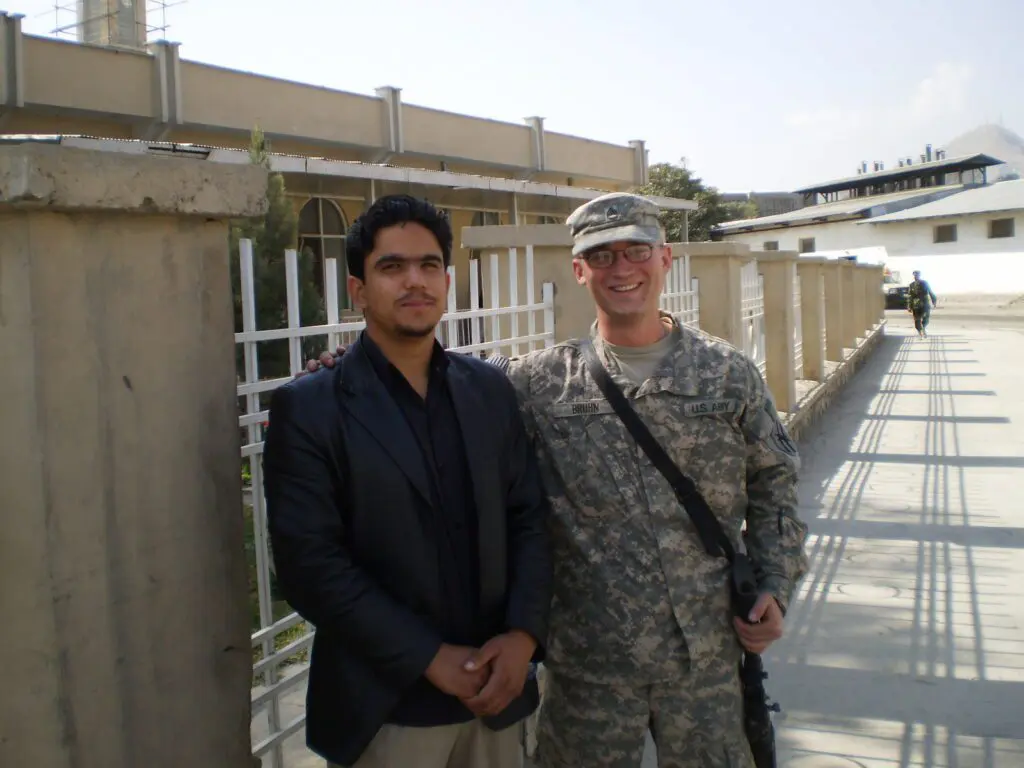 Rob in the Army posing with his interpreter in Kabul, Afghanistan.