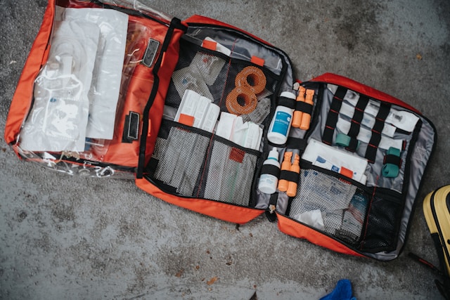 Open first aid kit showing basic supplies