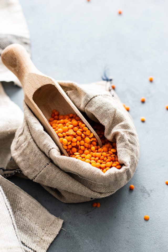 Red lentils in a burlap bag