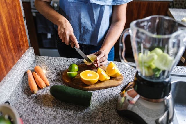 Preparing fresh ingredients for gut-healing smoothie with blender