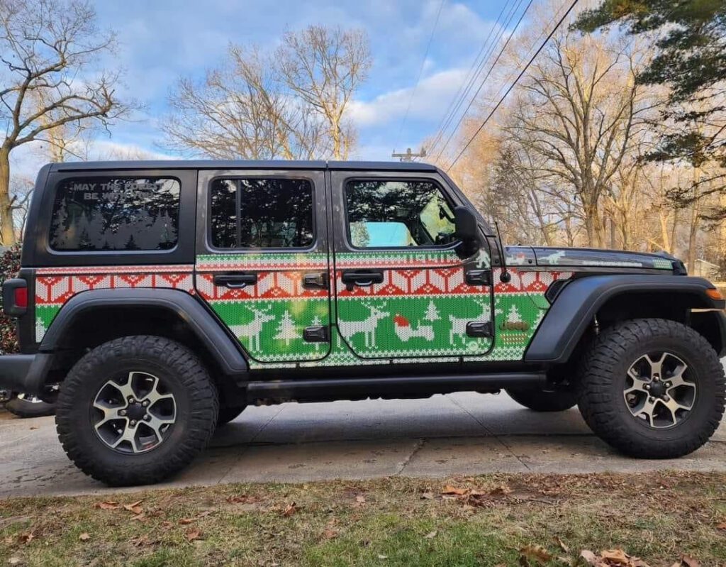 Jeep Wrangler with festive Ugly Sweater Trail Armor parked outdoors