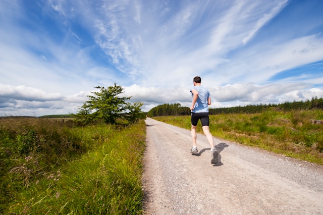 Man running on a country road to manage ADHD without medication