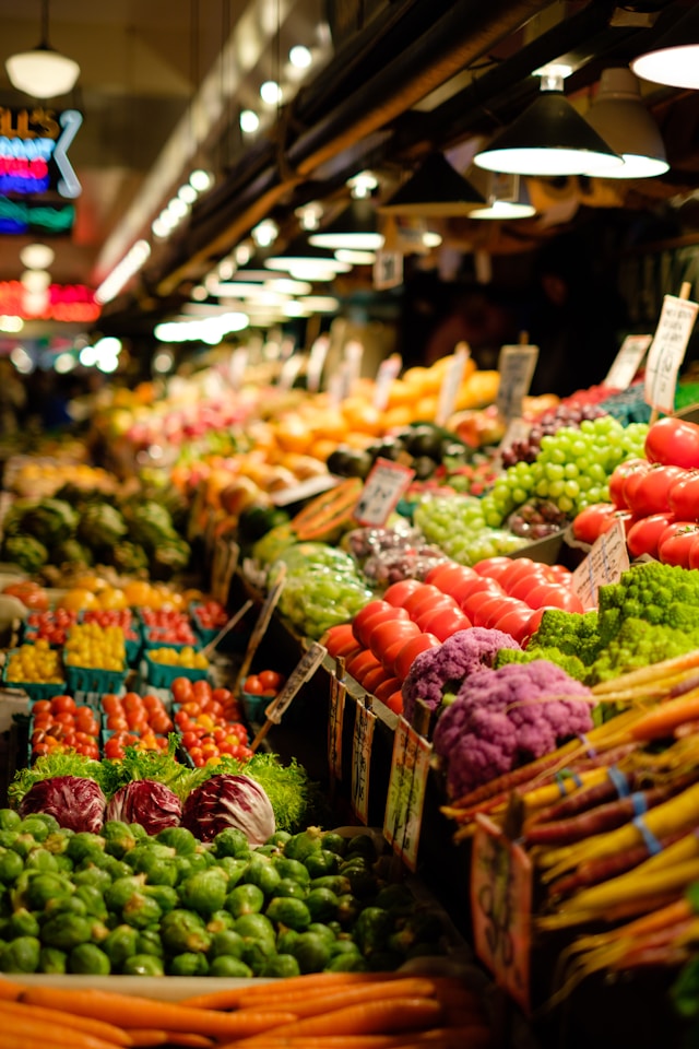 Colorful non-GMO produce displayed at a local farmers market.