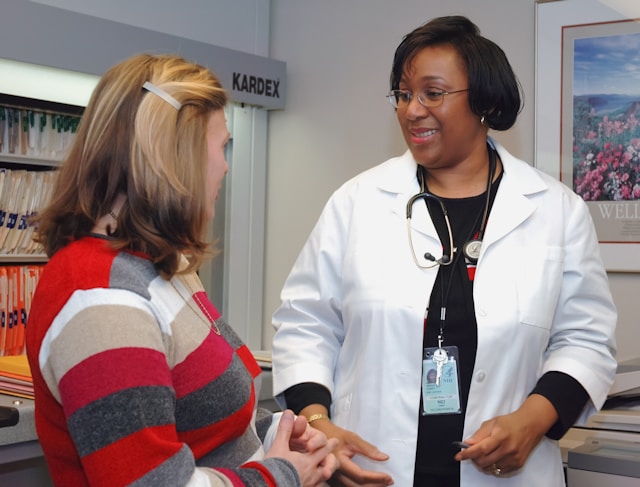 A patient talking to a doctor in a medical office about how to get an emotional support dog