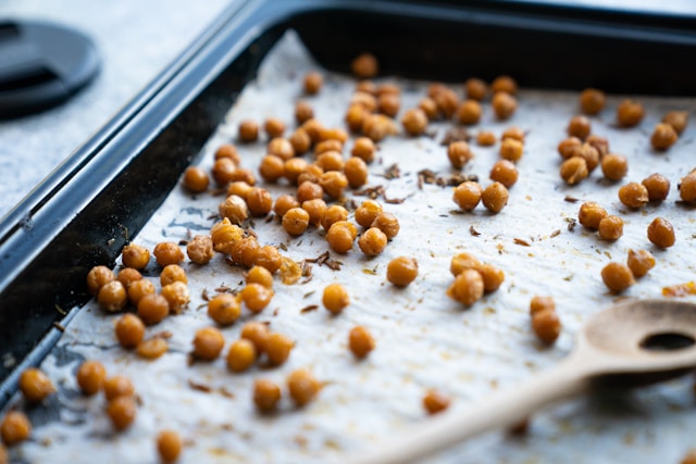 A tray of homemade roasted chickpeas, a crunchy and protein-rich vegan snack.