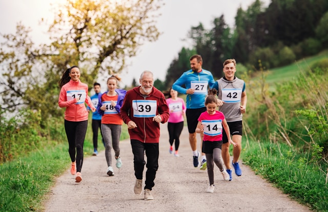 A diverse group of participants, from children to seniors, running in a rural fun run, promoting community and fitness.